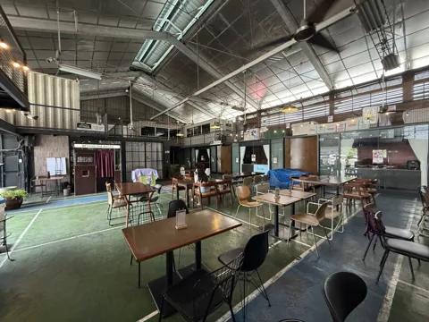 A wide view of tables and seating around Jungle Base Commons