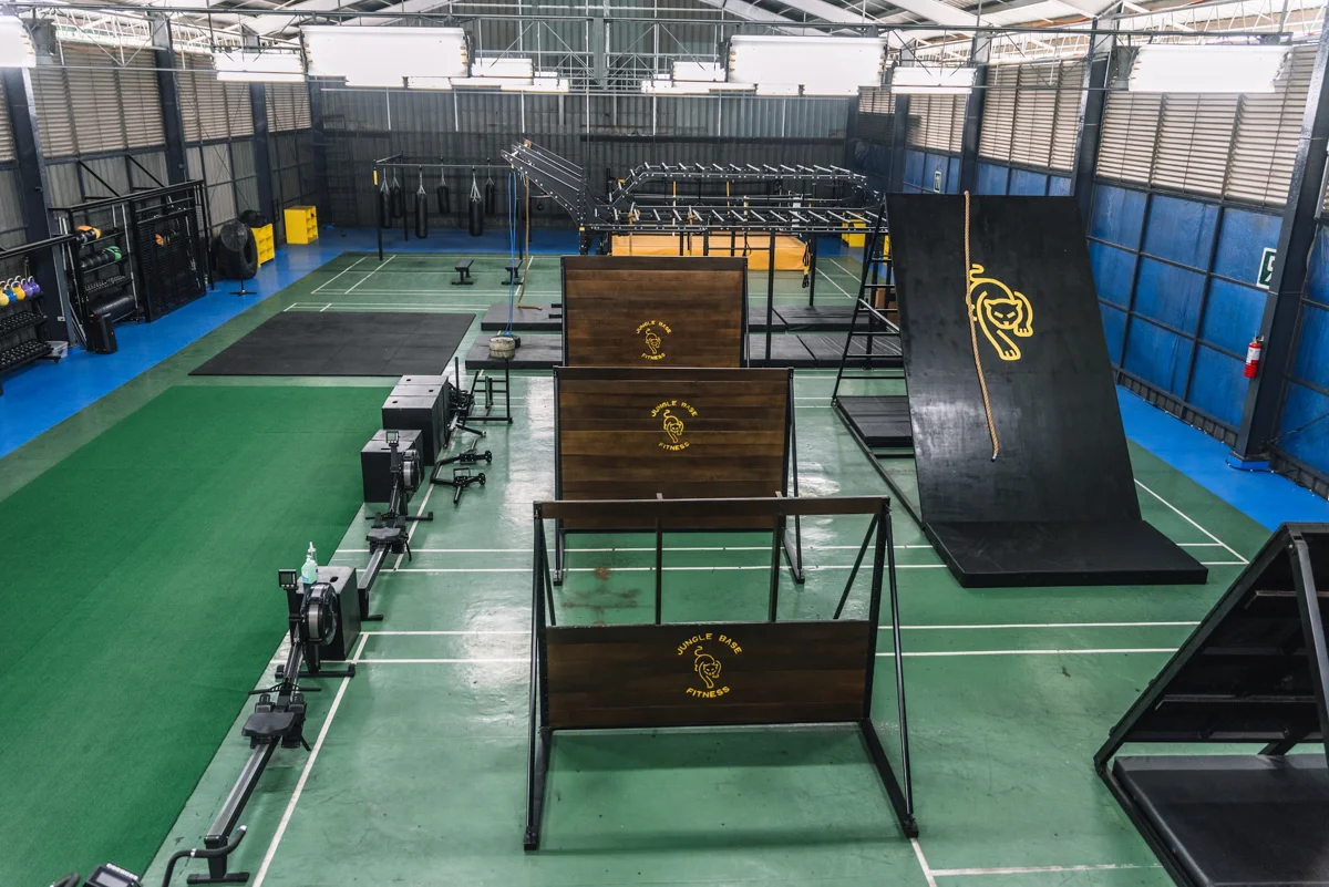 Obstacle walls, training rigs, and green lanes at Jungle Base Fitness